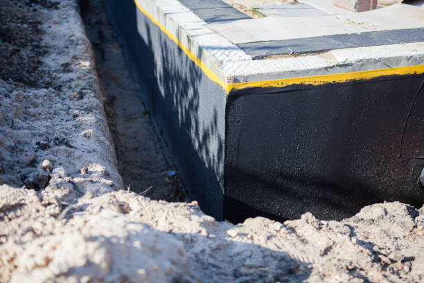 Professional Waterproofing technician working in White Cloud, MI